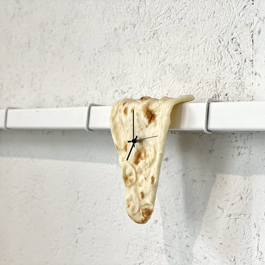 PAMPSHADEの曲がりナン型時計「今、ナン時」は兵庫県尼崎市にあるネパールカレー屋からご提供いただいた本物のナンを使ったインテリア時計